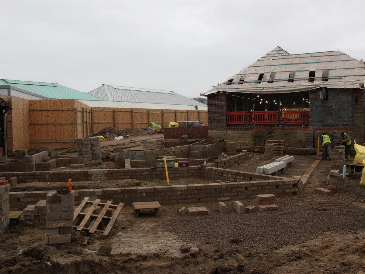 Blockwork foundations for the Link Barn with the Old Barn behind