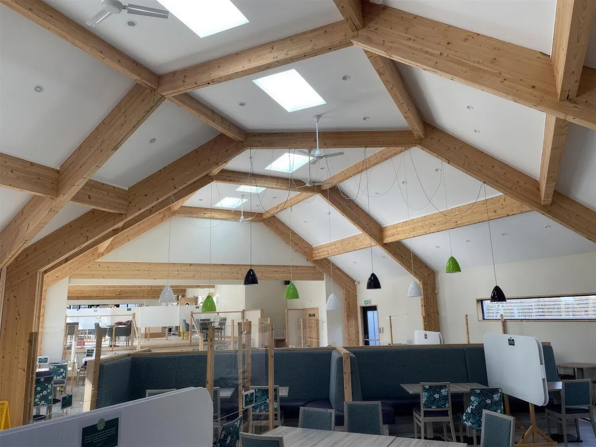 The finished Link Barn seating area under its exposed glulam frame