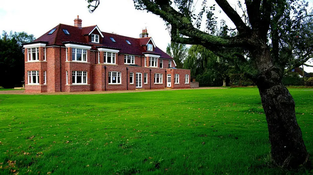 The finished St George’s Hill house across its lawn