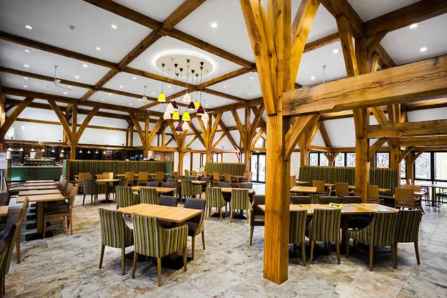 Oak posts and braces rising over the cafe seating area