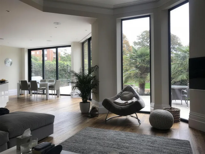 Open-plan living space with full-height glazing at Wilbury Gardens, Hove